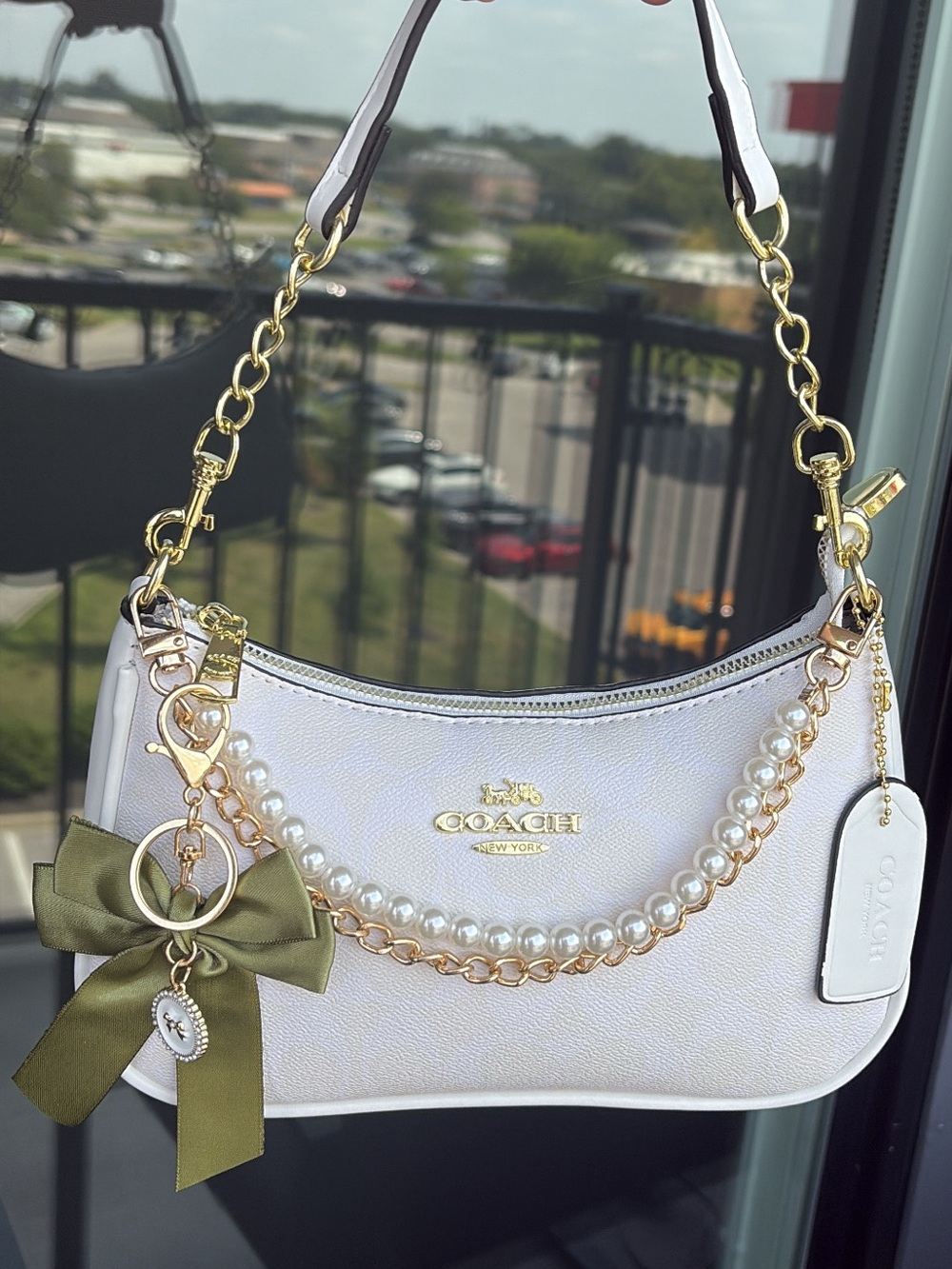 Coach White Shoulder Bag with Gold Hardware and Olive Bow